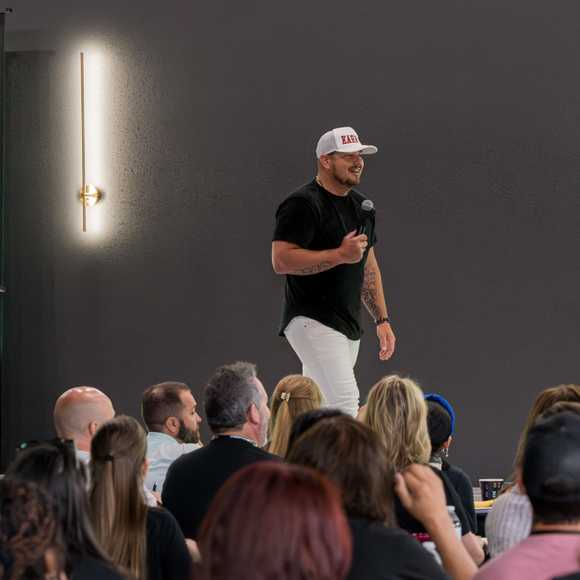 Josh presenting live to plumbing owners at the Mastermind Event